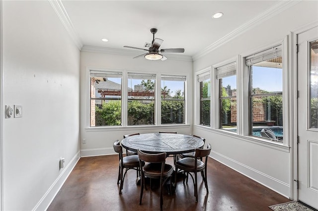 sunroom featuring ceiling fan