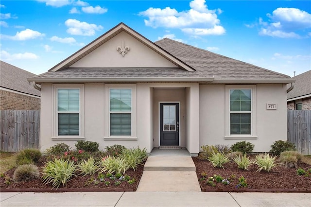 471 E Lakeshore Vlg, Slidell, LA 70461 - view of front of home featuring stucco siding and roof with shingles