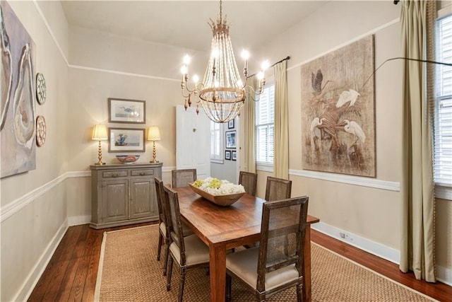 dining room with a notable chandelier and dark hardwood / wood-style floors