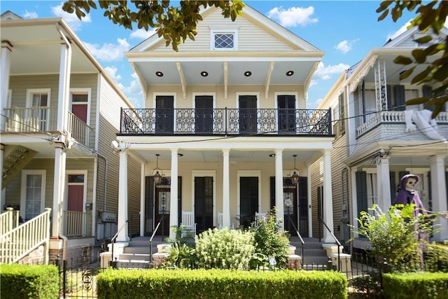 view of front of home featuring covered porch and a balcony