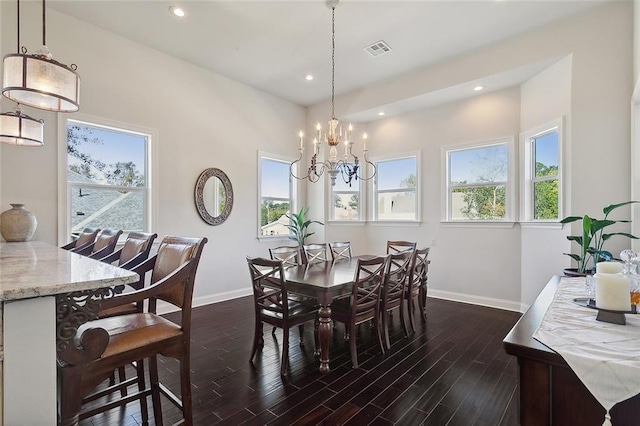 dining space featuring plenty of natural light, dark hardwood / wood-style floors, and a chandelier