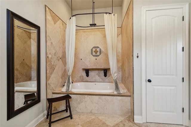 bathroom featuring shower with separate bathtub