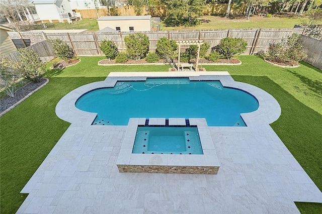 view of pool with a yard and an in ground hot tub