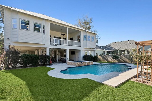 view of swimming pool featuring a patio area and an in ground hot tub