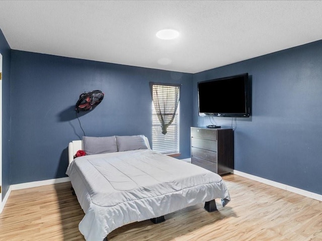 bedroom featuring light wood-type flooring