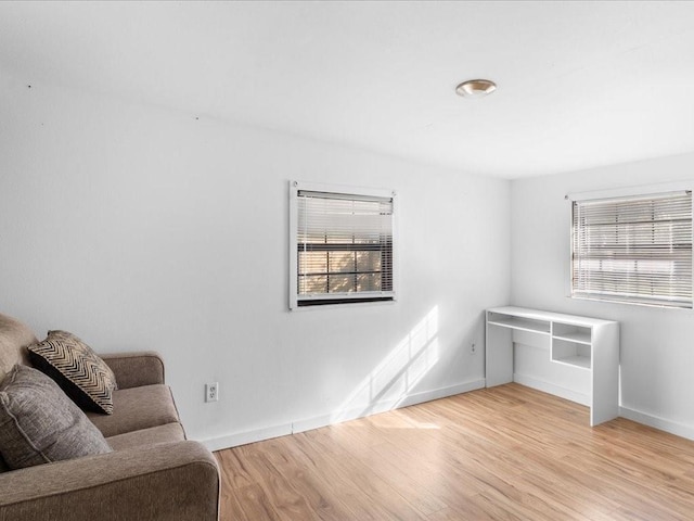 living area with light hardwood / wood-style flooring