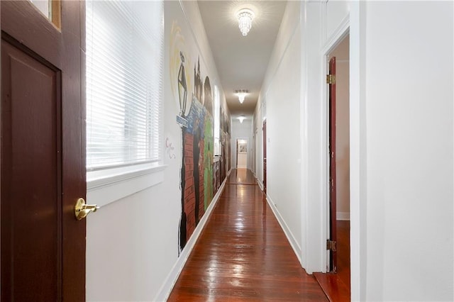 2108 Louisiana Ave, New Orleans, LA 70115 - hallway featuring dark wood-style floors and baseboards