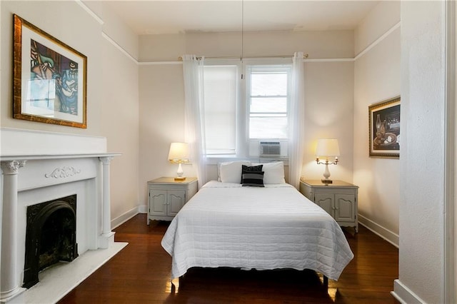 2108 Louisiana Ave, New Orleans, LA 70115 - bedroom with dark wood-style floors, a fireplace with raised hearth, and cooling unit
