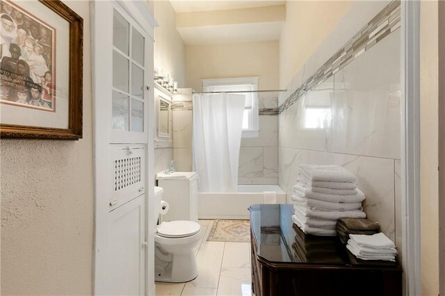 bathroom featuring toilet and shower / tub combo with curtain