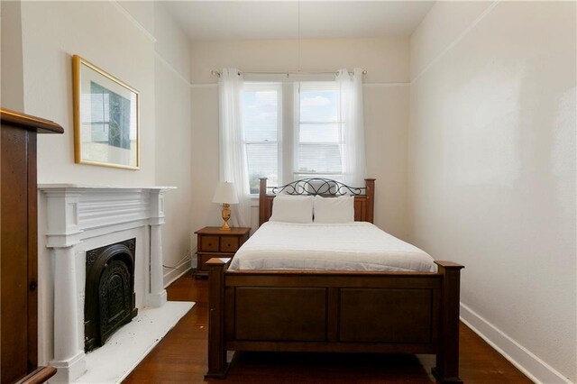 bedroom featuring dark wood-type flooring