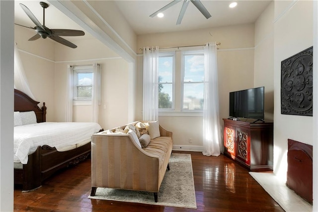 bedroom featuring ceiling fan and dark wood-type flooring