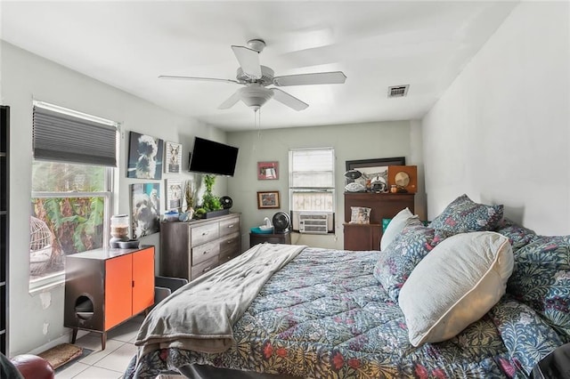 tiled bedroom featuring visible vents and a ceiling fan