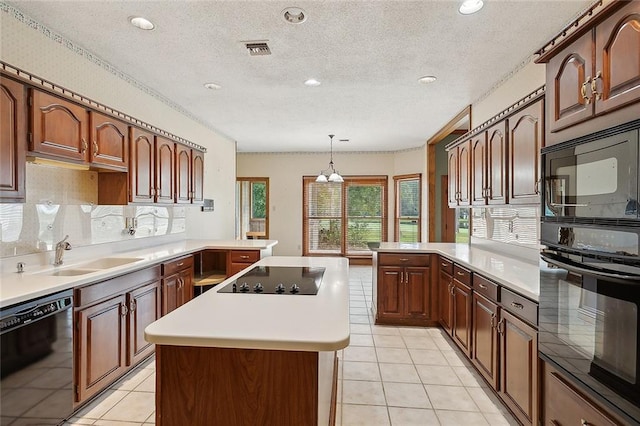 kitchen featuring kitchen peninsula, sink, hanging light fixtures, and black appliances