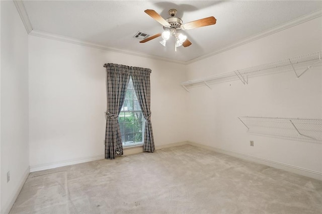 spacious closet featuring carpet flooring and ceiling fan