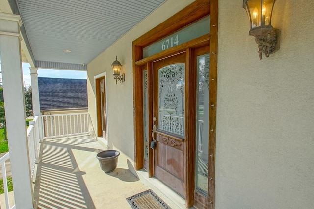 entrance to property with covered porch