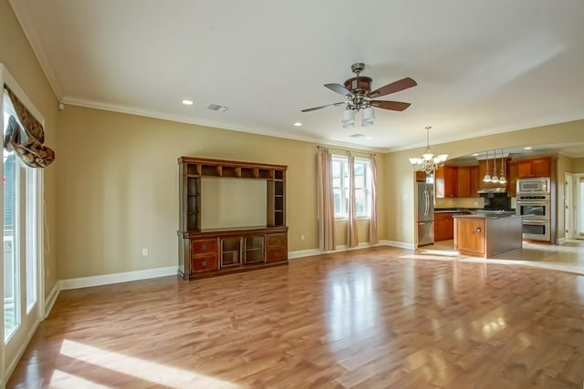 unfurnished living room with light hardwood / wood-style flooring, ceiling fan with notable chandelier, and ornamental molding