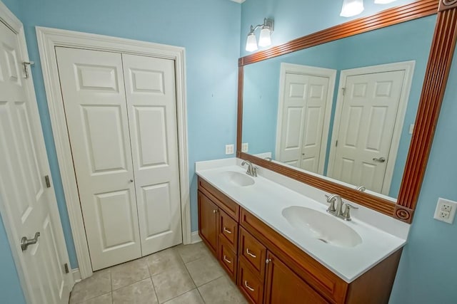 bathroom with tile patterned flooring and vanity