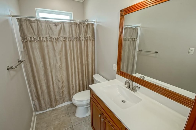 bathroom featuring tile patterned floors, curtained shower, vanity, and toilet