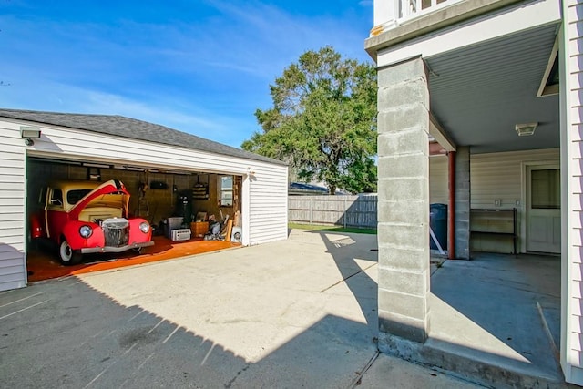 view of patio / terrace featuring an outbuilding and a garage