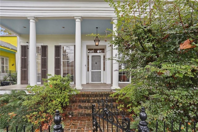 entrance to property featuring covered porch