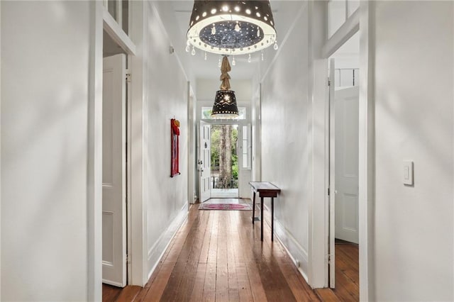 corridor featuring wood-type flooring