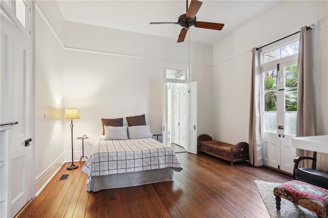 bedroom with ceiling fan and dark hardwood / wood-style flooring