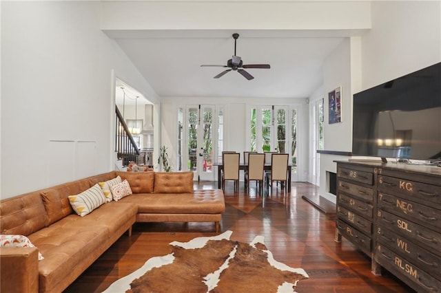 living room with dark hardwood / wood-style floors, ceiling fan, and vaulted ceiling