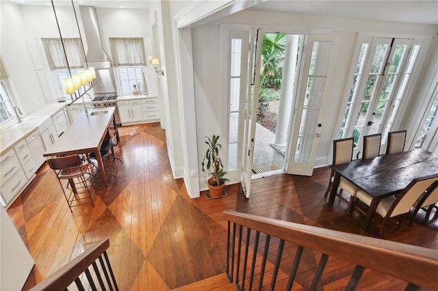 foyer with wood-type flooring and french doors