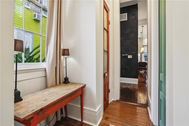 corridor featuring hardwood / wood-style floors