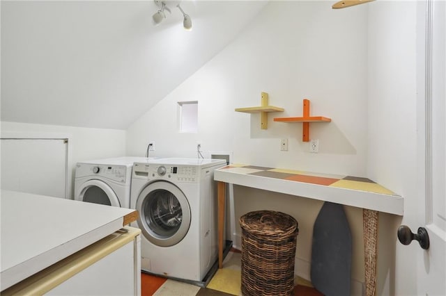 clothes washing area with independent washer and dryer