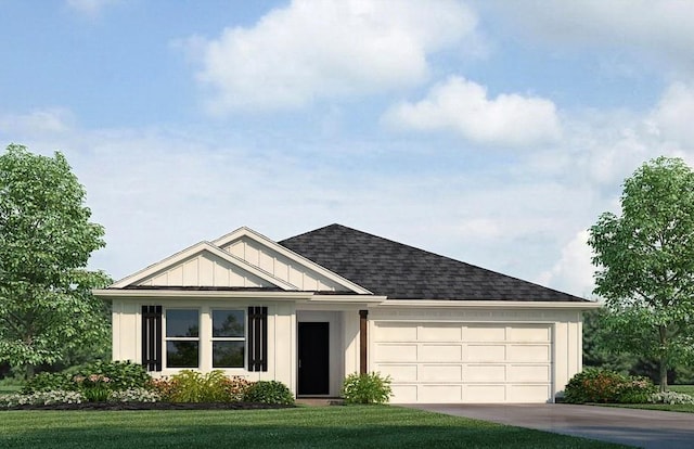 view of front of property featuring a front yard and a garage