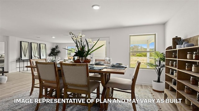 dining room with light hardwood / wood-style floors