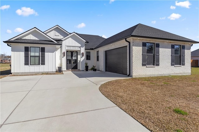 view of front facade with a front yard and a garage