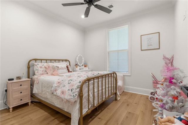 bedroom featuring crown molding, light hardwood / wood-style flooring, and ceiling fan