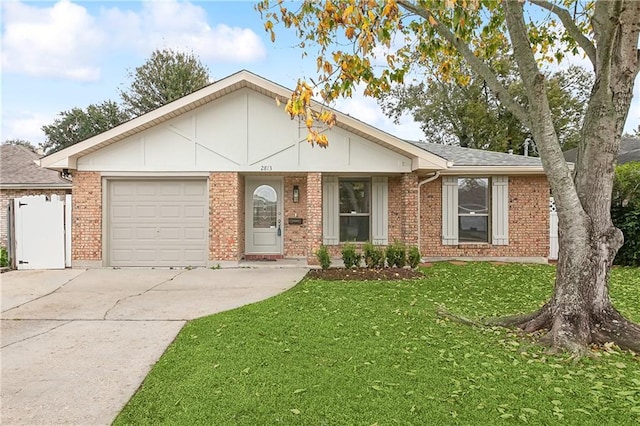 ranch-style house featuring a front yard and a garage