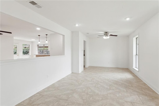 spare room with ceiling fan