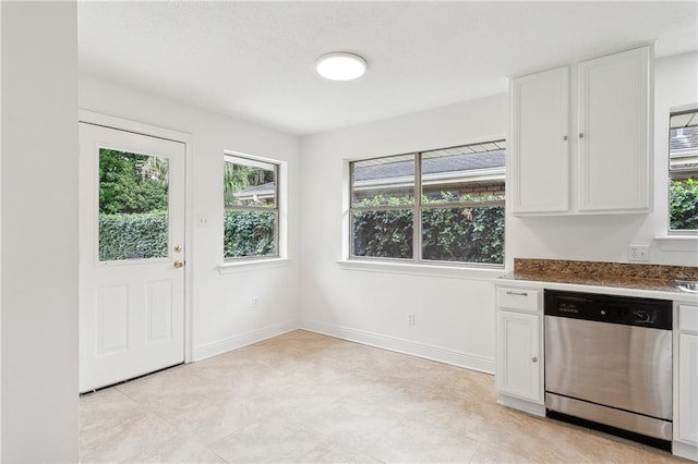 2813 Taft Park, Metairie, LA 70002 - kitchen featuring dishwasher, white cabinetry, and plenty of natural light