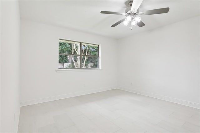 spare room with ceiling fan