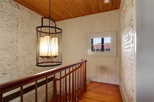 hallway featuring wooden ceiling and wood-type flooring