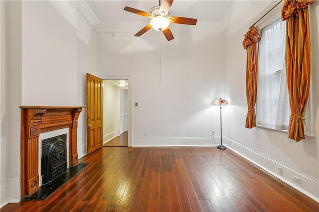 unfurnished living room featuring dark hardwood / wood-style flooring, ceiling fan, and crown molding