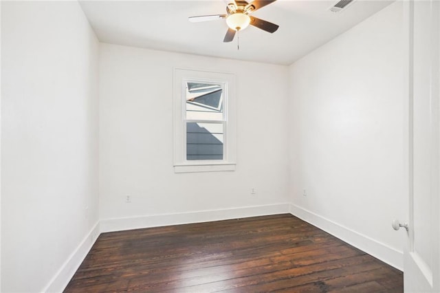 unfurnished room featuring ceiling fan and dark hardwood / wood-style floors