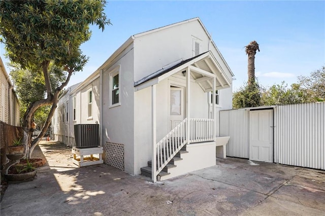 view of side of property with a patio area