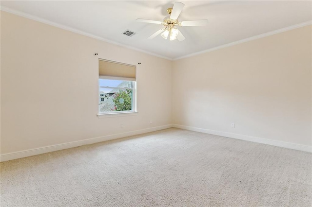 carpeted empty room featuring crown molding and ceiling fan