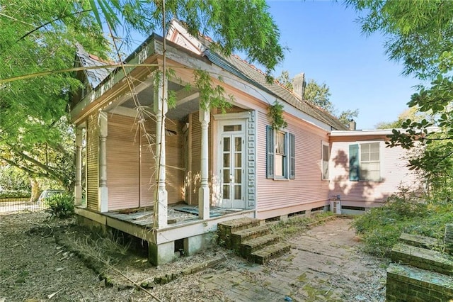 view of property exterior with french doors