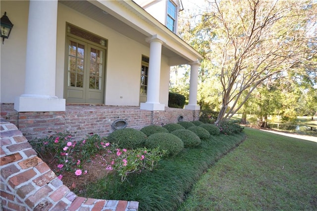 exterior space with a porch and a yard