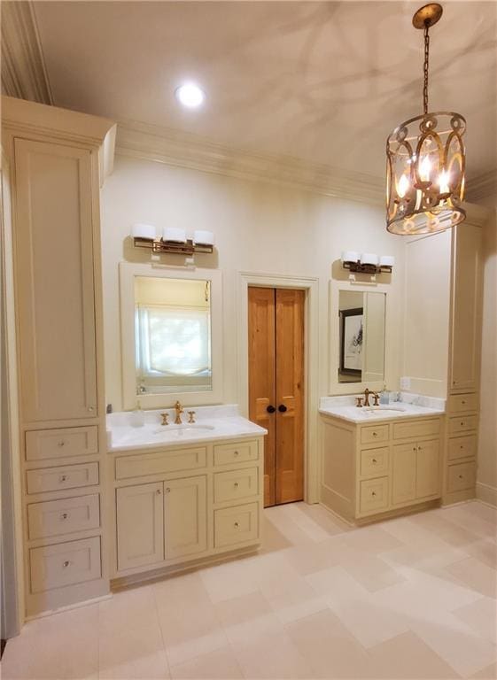 bathroom featuring vanity, an inviting chandelier, and crown molding