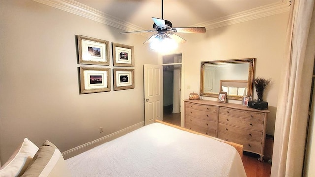 bedroom with hardwood / wood-style floors, ceiling fan, and ornamental molding