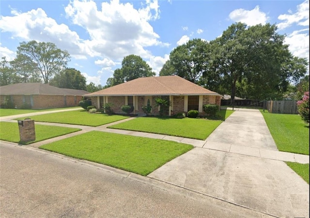 ranch-style house featuring a front lawn