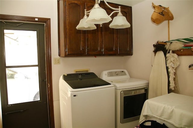 laundry area with cabinets and separate washer and dryer