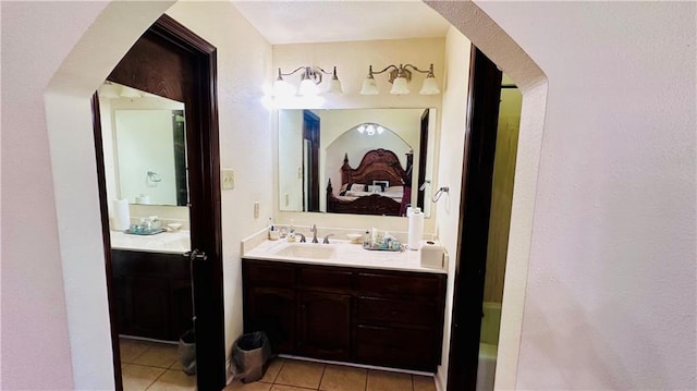 bathroom with tile patterned flooring and vanity